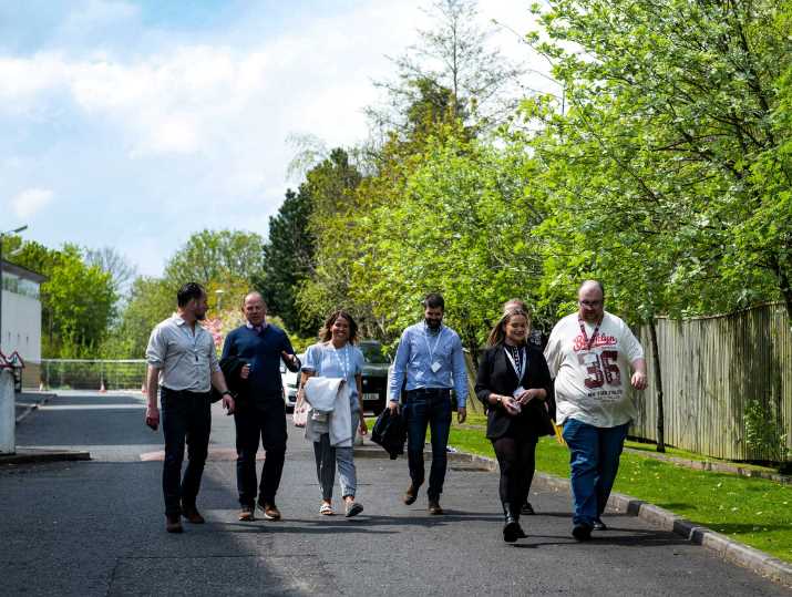 A group of attendees at the 50th Walk at Work Award ceremony enjoy a walk around the local area.